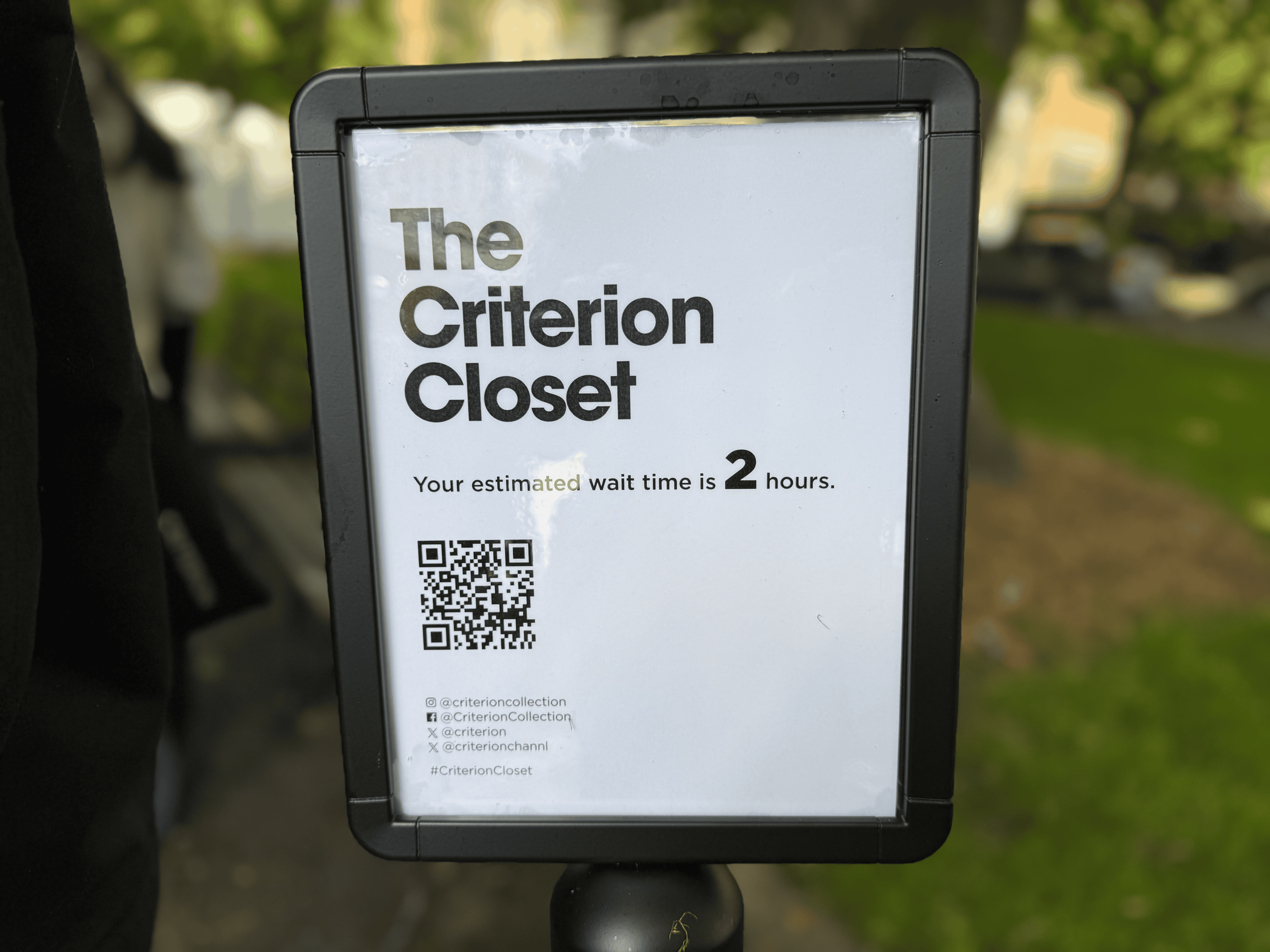 A sign reading 'The Criterion Closet: your wait time is 2 hours'