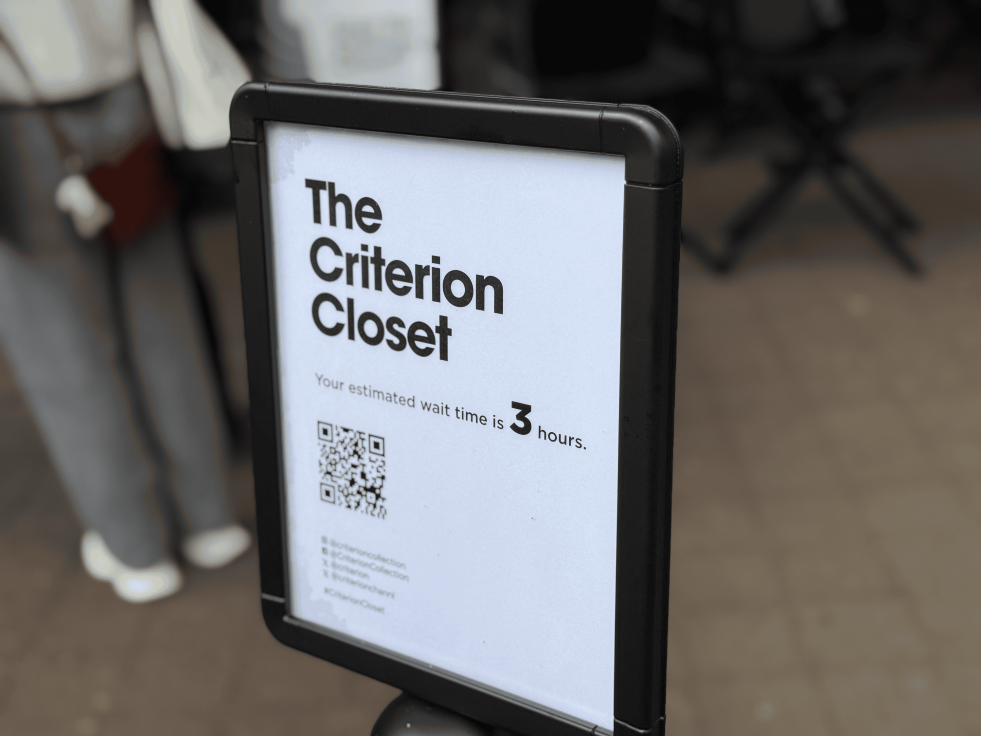A sign reading 'The Criterion Closet: your wait time is 3 hours'