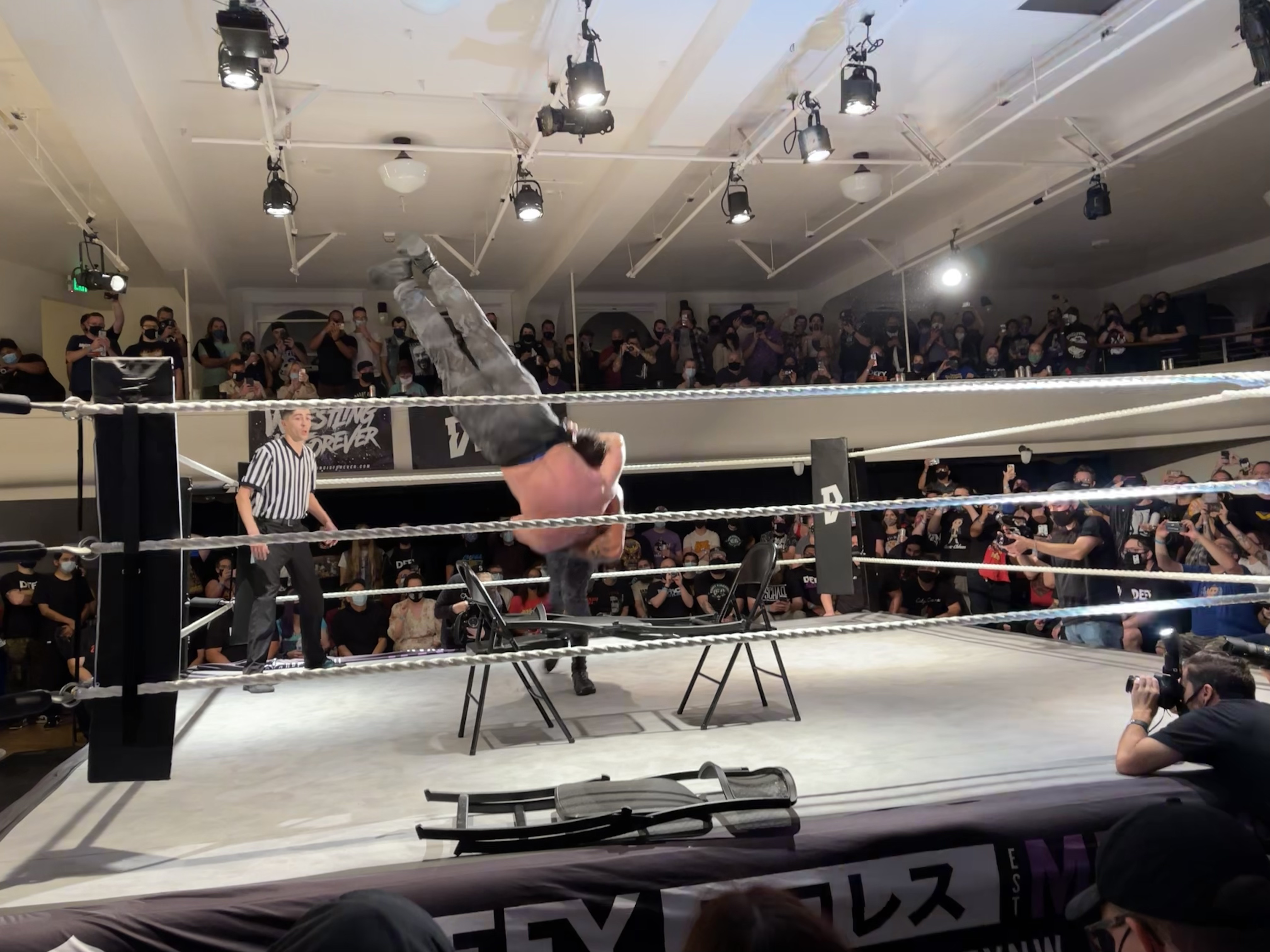 Moxley going through chairs