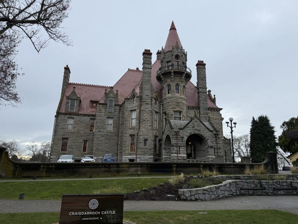 Craigdarroch Castle from a slight distance — it’s a big Romanesque Revival stone building.